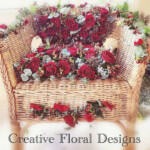 Red rose decorated chair by Creative Floral Designs
