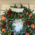 Rose and crocosmia wreath by Creative Floral Designs